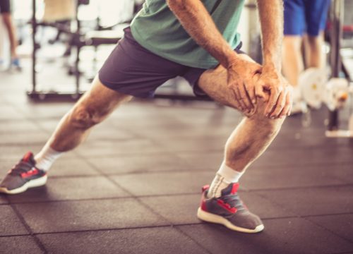 Photo of a man stretching before exercise